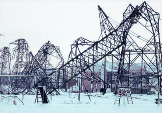 Aftermath of the 1998 North American Storm, which destroyed electrical infrastructure. Featured in the image is bent and destroyed electrical towers.